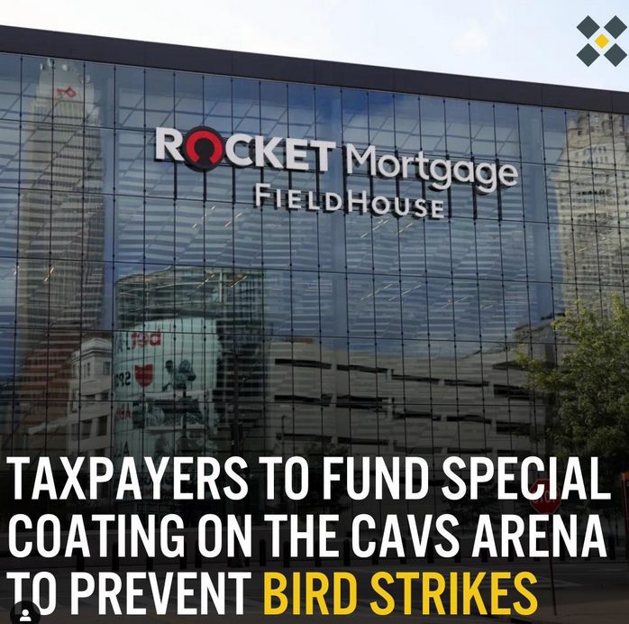 Rocket mortgage office building, glass facade, downtown urban setting, financial services branding, modern architecture.